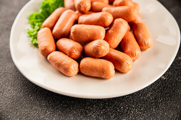 Mini sausages fresh delicious processed meat tasty snack fresh delicious gourmet food background on the table rustic food top view copy space