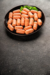 Mini sausages fresh delicious processed meat tasty snack fresh delicious gourmet food background on the table rustic food top view copy space