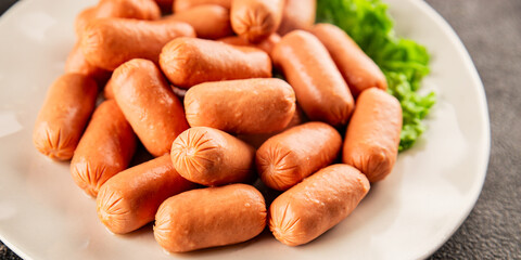 Mini sausages fresh delicious processed meat tasty snack fresh delicious gourmet food background on the table rustic food top view copy space