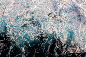 Sea surface background. Aerial view of vibrant foamy water. Can be used in covers, packaging, posters, textures, wallpapers, art and design projects. Captivating vector illustration.