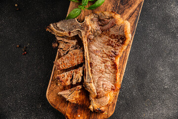 t-bone steak roast cut of meat juicy roast beef tasty snack fresh delicious gourmet food background on the table rustic food top view copy space