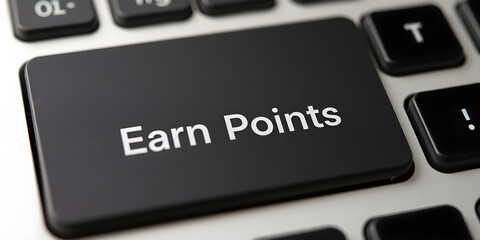 Fototapeta premium Earn Points - a system in which participants accumulate points through certain activities or achievements, text button on keyboard
