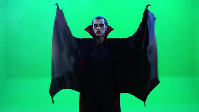 Spooky vampires sinister embrace with spread wings