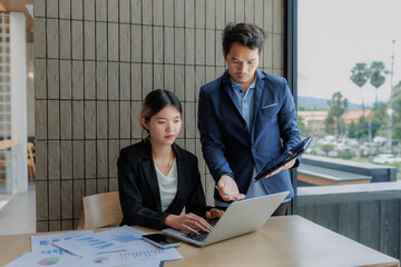 Businessmen and businesswomen collaborating to finalize investment strategies.