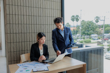 Businessmen and businesswomen collaborating to finalize investment strategies.