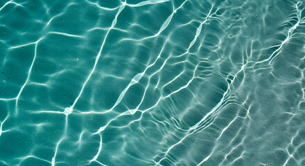 Fototapeta premium Abstract Teal Water Texture: Subtle Light Reflections on Rippling Surface, Serene and Calming Aquatic Background.