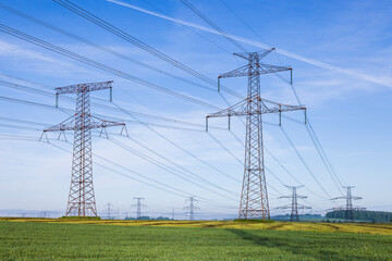 Electricity pylons transporting energy in Czechia countryside