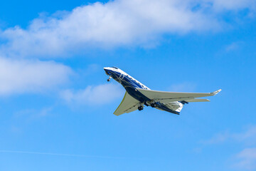 Private jet taking off from Hostivice Airport in Czechia under blue sky