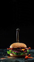 Knife-pierced cheeseburger layered with bacon, lettuce, and tomato in bold tabletop setting. Generative AI