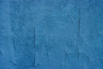 An old, worn concrete wall with slight cracks.