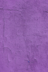 Vertical photo of a purple wall.