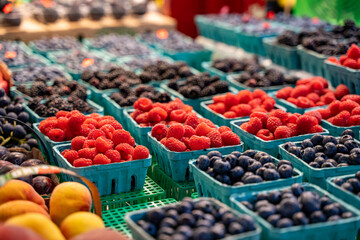 View of blackberries raspberries and blueberries in grocery store.