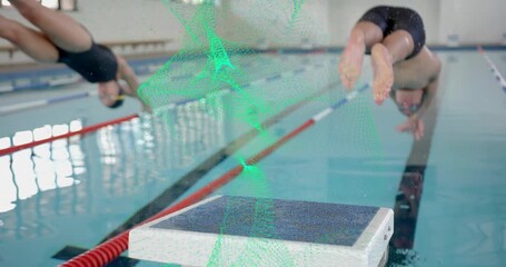 On buzzer sound two swimmers pushing off starting block and generating splashes for swim training