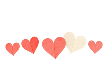 Row of paper hearts in coral and cream colors on transparent backdrop