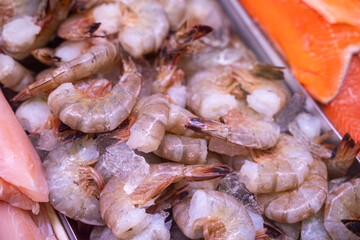 View of fresh white shrimps in fish market.