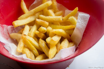 photograph of french fries served in a bowl