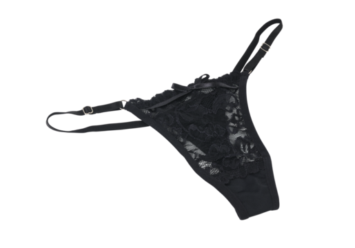 Women's sexy black thong panties on a white background. 