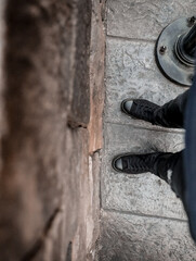 cowboy boots on a wooden wall