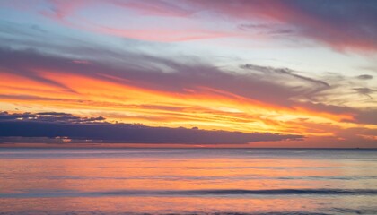 Fototapeta premium Colorful sunset over calm ocean