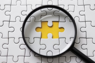 Magnifying glass focusing on a missing puzzle piece with a yellow background, symbolizing problem-solving, searching for solutions, finding the missing link, strategy, and critical thinking.