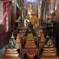 Golden Buddhist art in an ancient temple in Luang Prabang, northern Laos