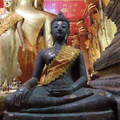Golden Buddhist art in an ancient temple in Luang Prabang, northern Laos
