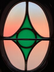 Colorful stained glass window with geometric abstract design