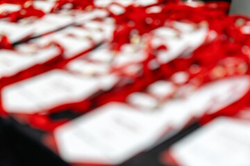 Blurred Event Name Tags Lanyards on Table Conference, Seminar, Business Networking, Registration Desk, Professional Meeting, Badge Holders, ID Cards, Corporate Gathering, Check in Setup, Welcome Area