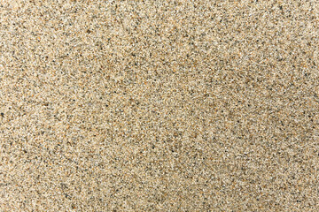 Close up of Fine Beach Sand Texture with Natural Ripples. Summer Vacation Background, Coastal Nature, Relaxation, Zen Garden, Abstract Grainy Surface for Travel, Spa, and Wellness Concepts