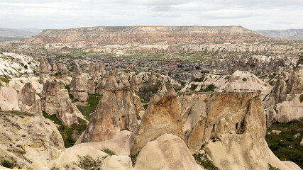 settlements and fairy chimneys built by human communities carving soft limestone in the Cappadocia region in the Middle Ages