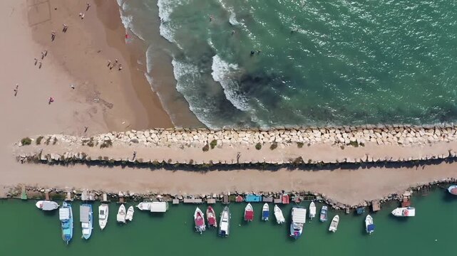 Aerial View Of Side Antique City . Side Old Town amphitheater. Side Harbor marina in Antalya Turkey drone video view.