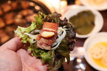 Korean bbq. ssam : eat pork wrapped in lettuce leaves