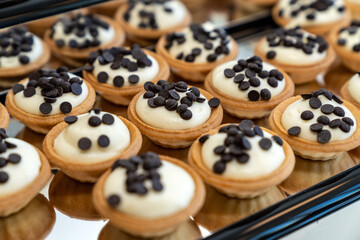 coffee break hotel during conference meeting, corporate revent with tea and coffee catering, decorated catering banquet table with variety of different pastry and bakery, with croissants and cookies