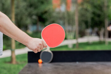 Two paddles and a ball ready for an exciting game of table tennis