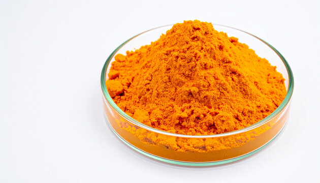 Glass plate of bright orange dichromate powder isolated on white backdrop. Chemistry and lab safety