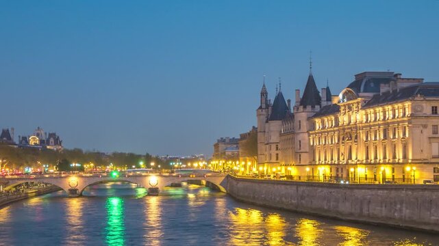 Paris France time lapse city skyline at Seine River and Conciergerie with Pont au Change bridge