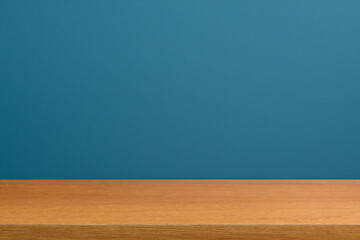 Empty wooden table top and color blue wall background for showing products and advertisers. Template mock up for display of product. product promotion in the wall. for display or montage.