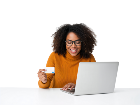 Cheerful young woman using credit card while doing online shopping using laptop with isolated