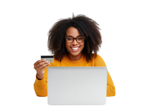 Joyful woman with afro hairstyle utilizing laptop and credit card for online payments on