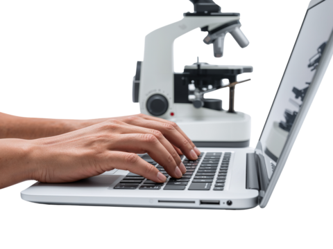 Hands typing on laptop with microscope on isolated transparent display, modern research tool usage