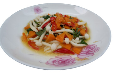 Stir-fried mushrooms with basil Delicious stir fry with sliced carrot, shimeji mushroom, and herbs this dish look so a vegetarian dish