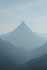 Misty-blue, the ridge of Ganal, the distant Ganal ridge. Light, ghostly, unearthly, it trembles in a stream in the steamy breath of the earth