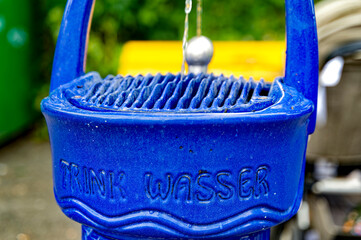 A public drinking water dispenser on a street in Berlin, Germany. “Trinkwasser” is the German word for drinkable water.