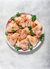 Marinated chicken wings prepared for grilling with spices and fresh herbs ready for cooking
