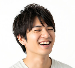 Happy Young Man Laughing with Eyes Closed Against a White Background