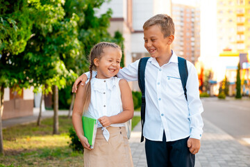 back to school, children walking to school holding hands, September 1, the beginning of the school year