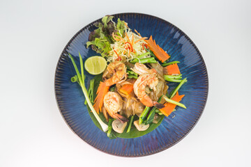 Stir-fried Rice Noodles with Soy Sauce and Seafood Which consists of squid and shrimp on white background , Thai Style food