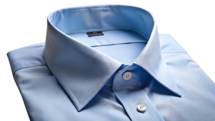 Close up of a folded light blue dress shirt on a dark background