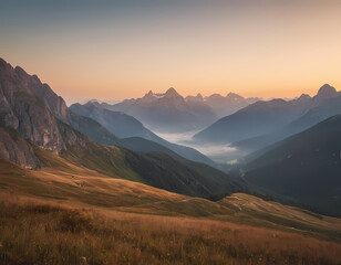 Obraz premium Mountain landscape at sunrise – golden light, misty valleys, dramatic peaks, peaceful atmosphere., sunset in the mountains
