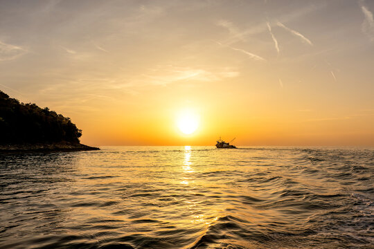Fishing boat on the Adriatic Sea at sunset near the Istrian coast